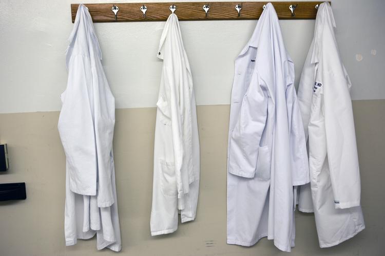 Photo of hanging doctors' coats