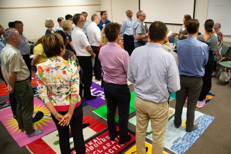 Photo of people taking part in blanket exercise