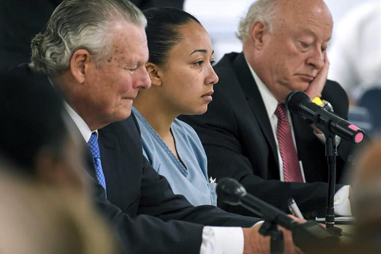 Photo of Cyntoia Brown and lawyers