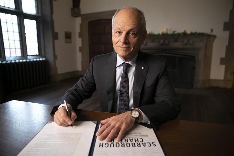 Meric Gertler signing the Scarborough charter