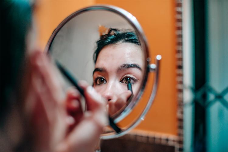 Woman doing her makeup