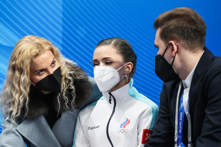 Russian Olympic Committee figure skater Kamila Valieva and her coaches attend the women's short program event at the Capital Indoor Stadium