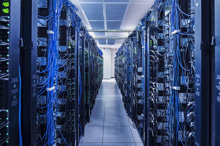 a computer server room with many racks of computers