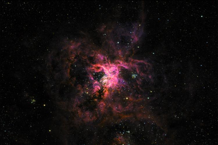 A false-colour image of the “Tarantula Nebula” taken in visible and ultraviolet light by the SuperBIT telescope shortly after launch.