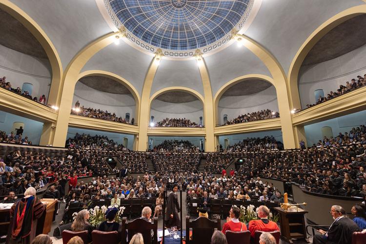 a wide view of a full convocation hall as seen from the stage