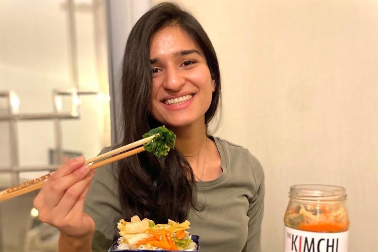 Meraj Ellahi holding up some of her kimchi