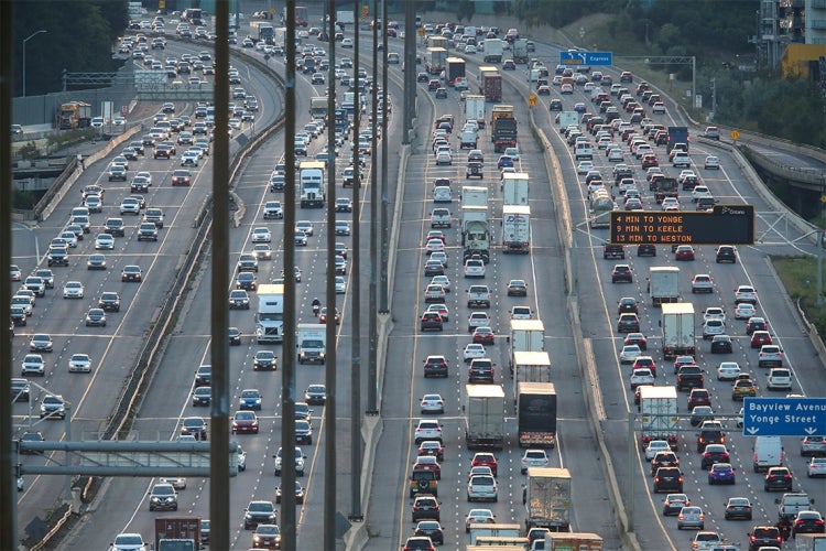 traffic jam on the 401 highway in Toronto with many trucks