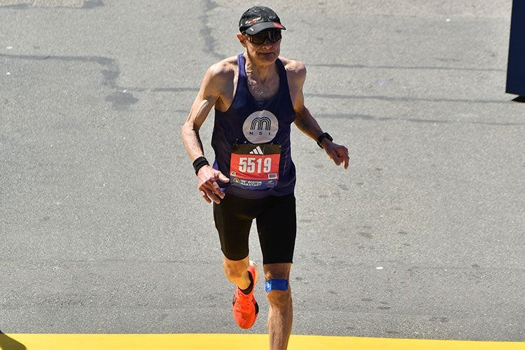 Paul Huyer crosses the finish line at the Boston Marathon