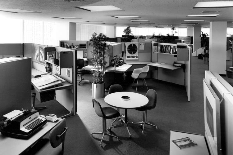 Photo of a mid-century open-concept office space