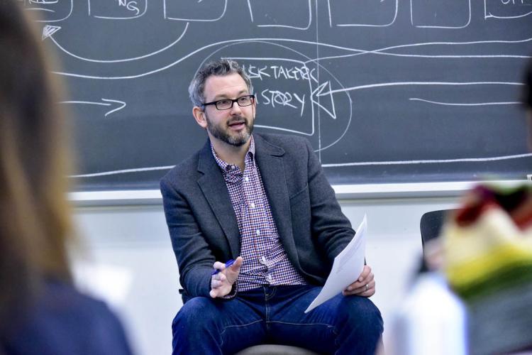 Andrew Westoll sits in the classroom