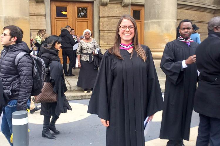 Erica Gavel outside Convocation Hall in her graduation robes