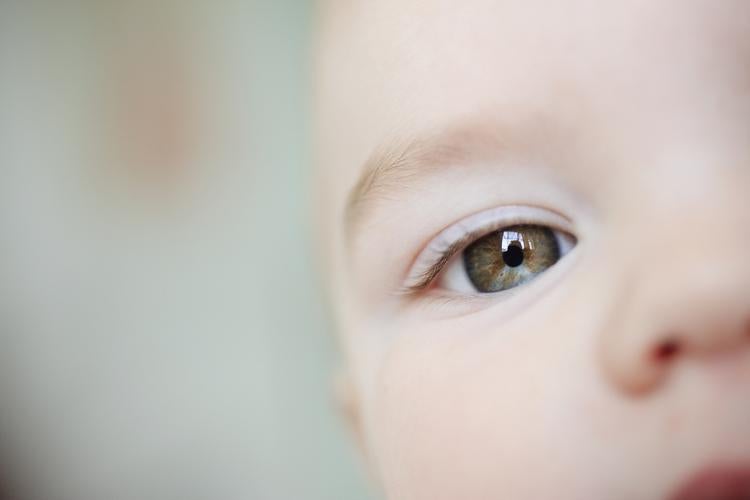 close up of a baby's face centered on their eye