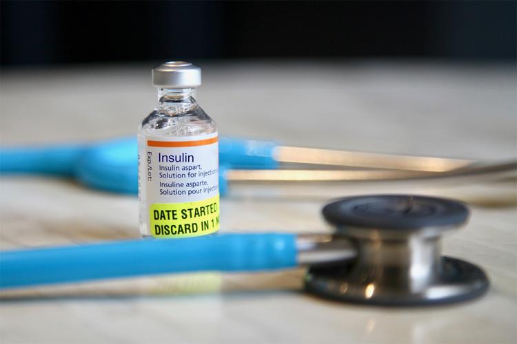 A vial of insulin on a table