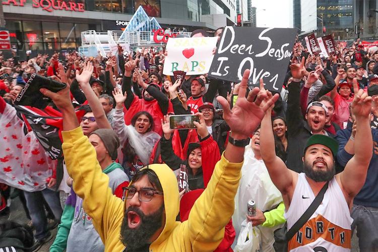 Fans cheering in Jurassic Park otherwise known as Maple Leaf Square, after the Raptors beat the Milwaukee Bucks