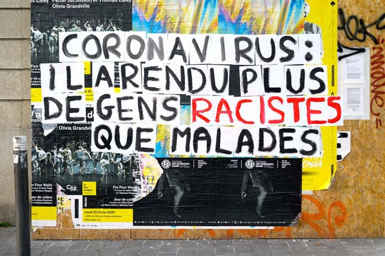 Photo of a sign plastered on a wall in France