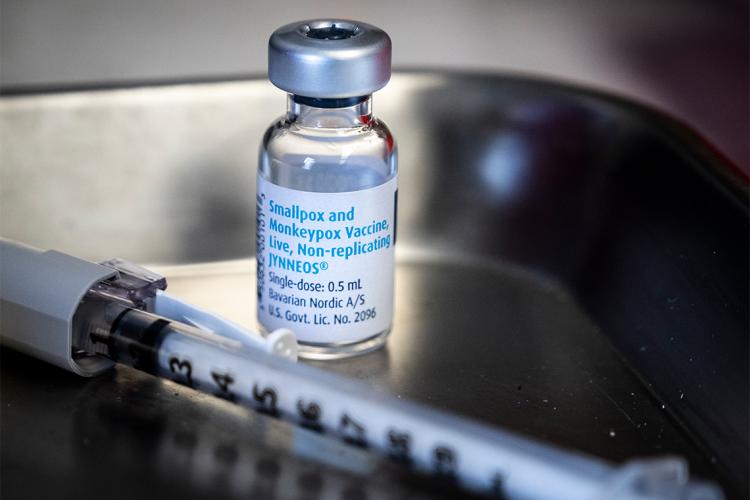 a vial of monkeypox vaccine and a syringe