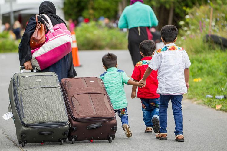 Photo of asylum-seekers making way to Canada-U.S. borders