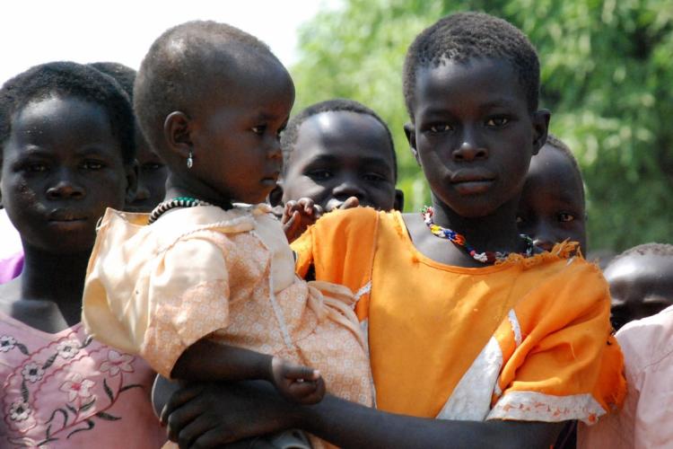 Displaced Sudanese children look into the camera