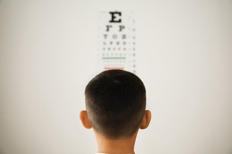 boy taking an eye exam