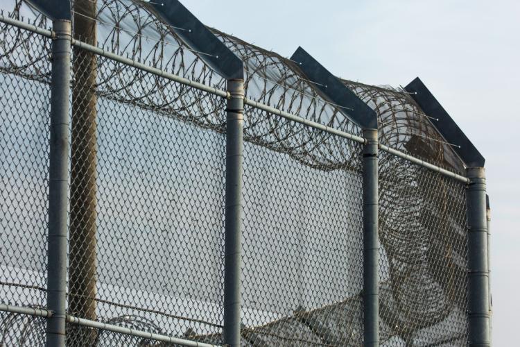 close up of a large prison fence in ontario