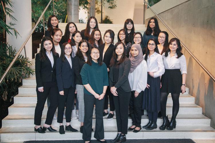 The organizing committee of the 2020 Women in Science and Engineering National Conference standing on a staircase