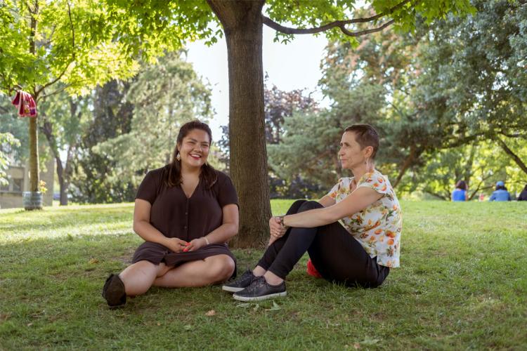 Portrait of Kateri Lucier-Laboucan and Andrea Mantin sitting at the site of the Indigenous Landscape project