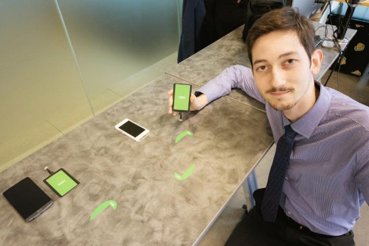 photo of grad with his device