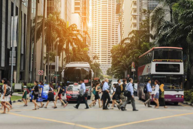 Photo of pedestrians crossing the street in Singapore