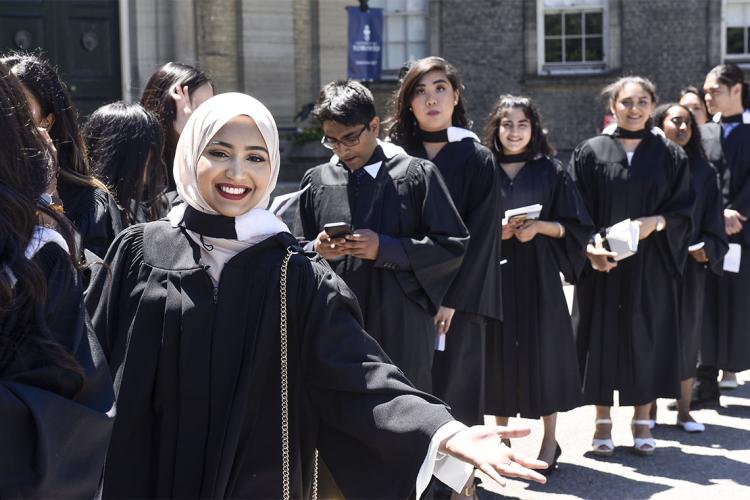 Graduands line up outside Simcoe Hall