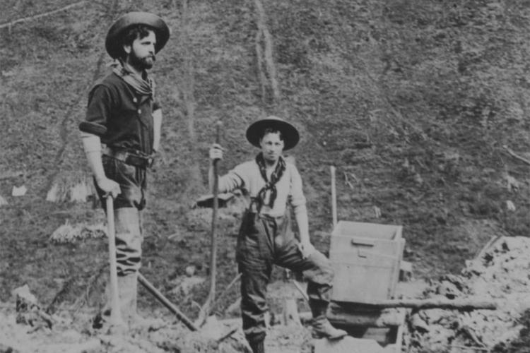 Two miners looking for gold in the yukon. Circa 1935