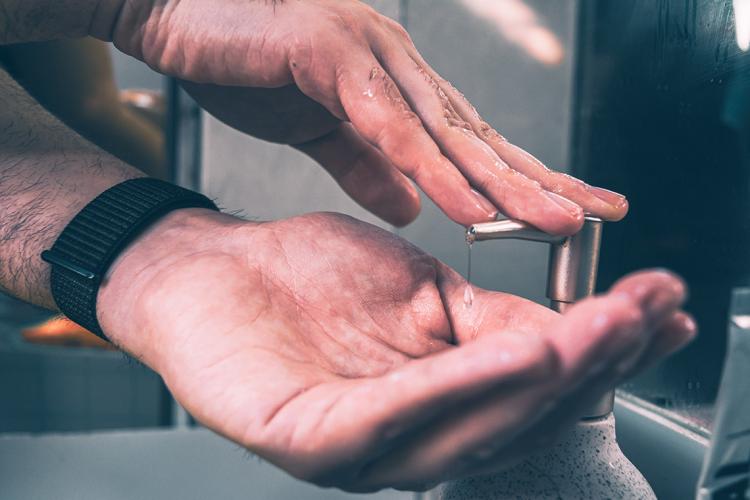 Close-up photo of hands being washed