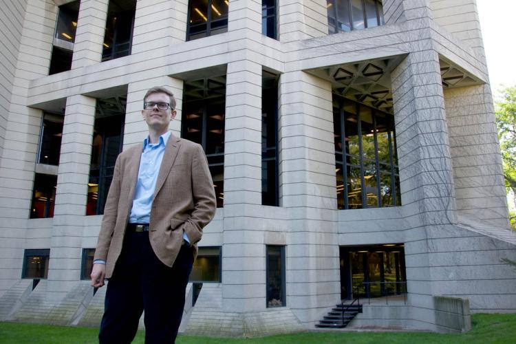 Joseph Clarke stands outside the Robarts Library