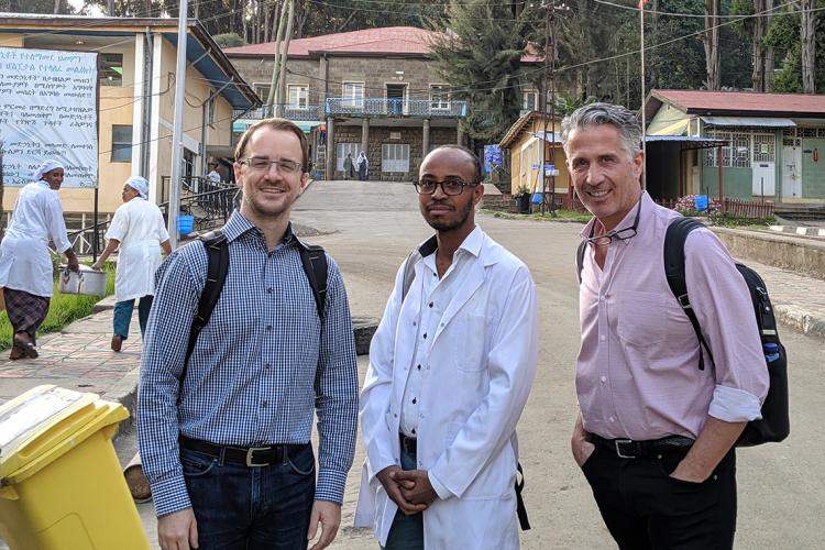 U of T faculty Karl Cuddy and Marco Caminiti with Ethiopian doctor