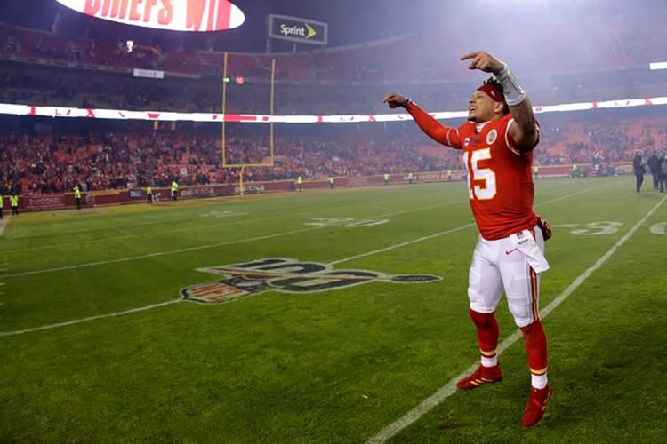 Photo of Kansas City Chiefs quarterback Patrick Mahomes celebrating on the field