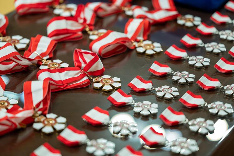 Order of Canada medals arrayed on a table
