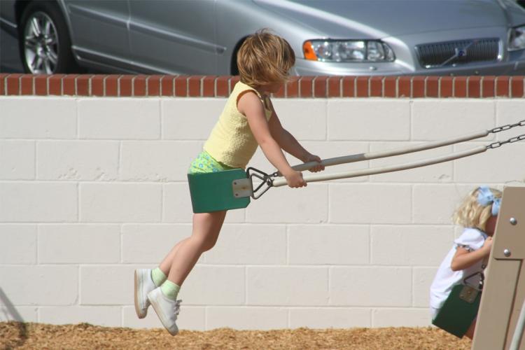 photo of child on swing