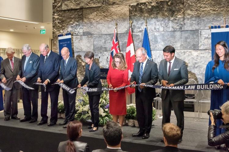 Cutting the ribbon - from left to right: Campaign Co-Chair Tom Rahilly, Chancellor Michael Wilson, the Hon. Hal Jackman, Dean Ed Iacobucci, Governing Council Chair Shirley Hoy, the Hon. Chrystia Freeland, Minister of International Trade with President Meric Gertler, alumnus and MP Arif Virani and Christina Liao, student gonfalonier.