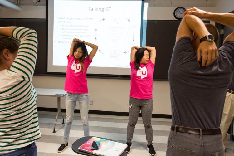 MoveU instructors lead a classroom movement break