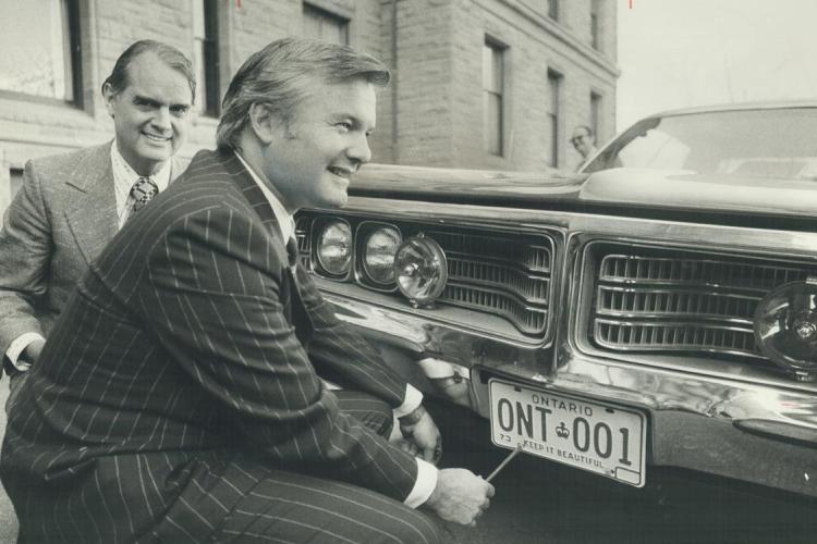Former Ontario Premier William Davis with the first renewable license plate