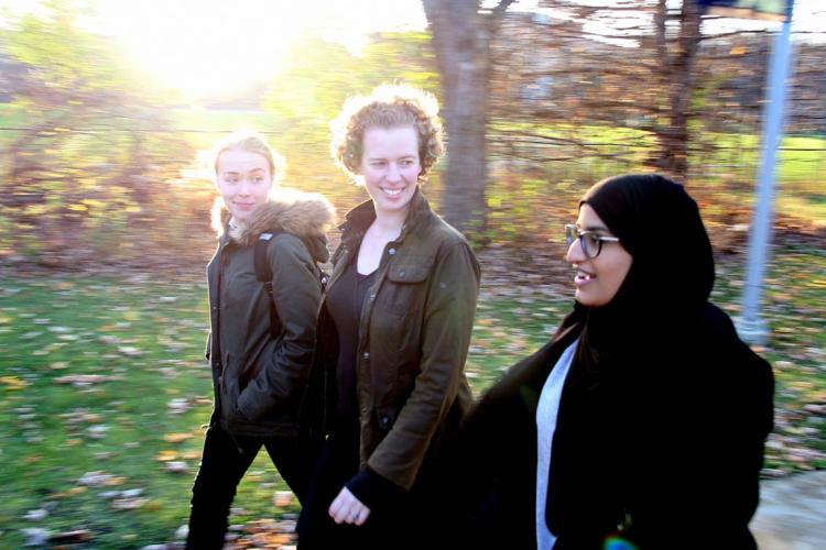 Fiona Rawle (centre) with students walking outside