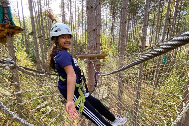 Divya Dey on a treerop rope course