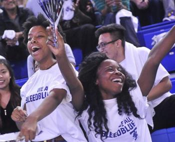 Students cheering on the Varsity Blues.