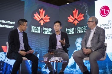 Chris Yip, U of T's associate vice-president of international partnerships, on stage at the Collision conference with LG representatives