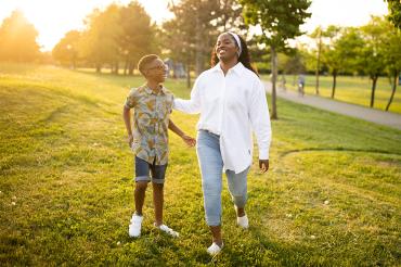 Thereasa and her son Romeo share a laugh in a park