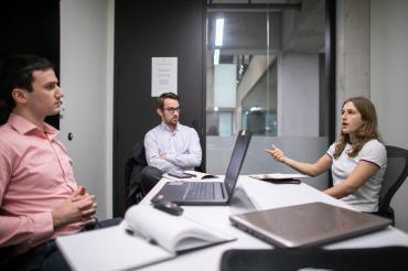 Emma Weiss talking with two of her clients