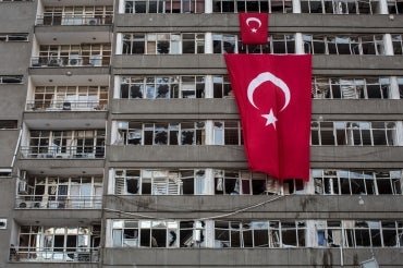 Turkey's flag draped over an abandoned building 