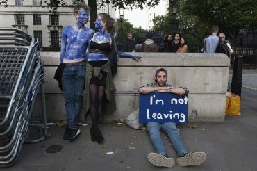  A young couple painted as EU flags protest on outside Downing Street against the United Kingdom's decision to leave the EU following the referendum on June 24, 2016 in London, United Kingdom.