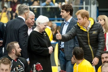 photo of Prince Harry with Prime Minister Trudeau and others at sledge hockey game