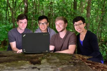 photo of the students with laptop in park