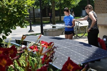 photo of students assembling car